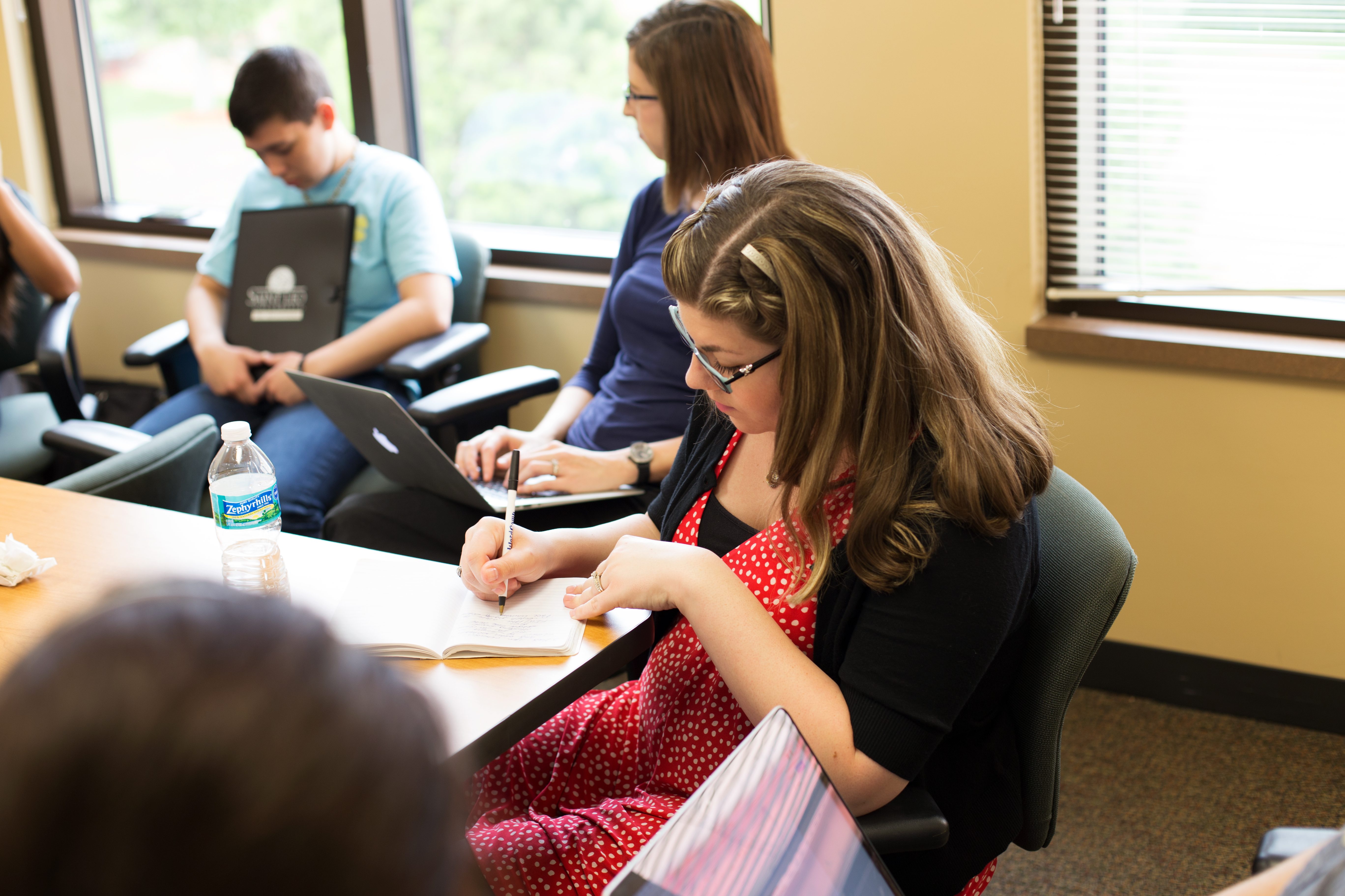 Echo Delta team member taking notes during discovery at Saint Leo University